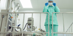 Hot air dehumidification system for pharmaceutical manufacturing and cleanroom humidity control